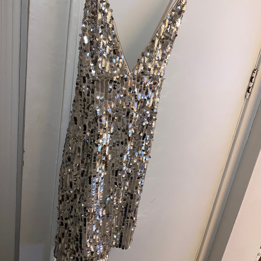 This dress was too small I got it for my bday never worn! But there is no tag on